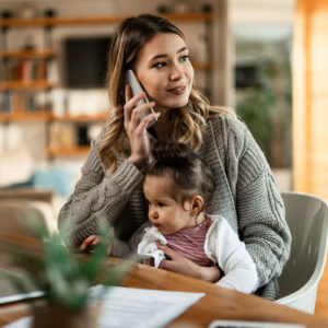 single mother using a laptop