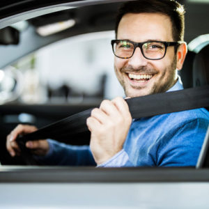 man buckles seatbelt